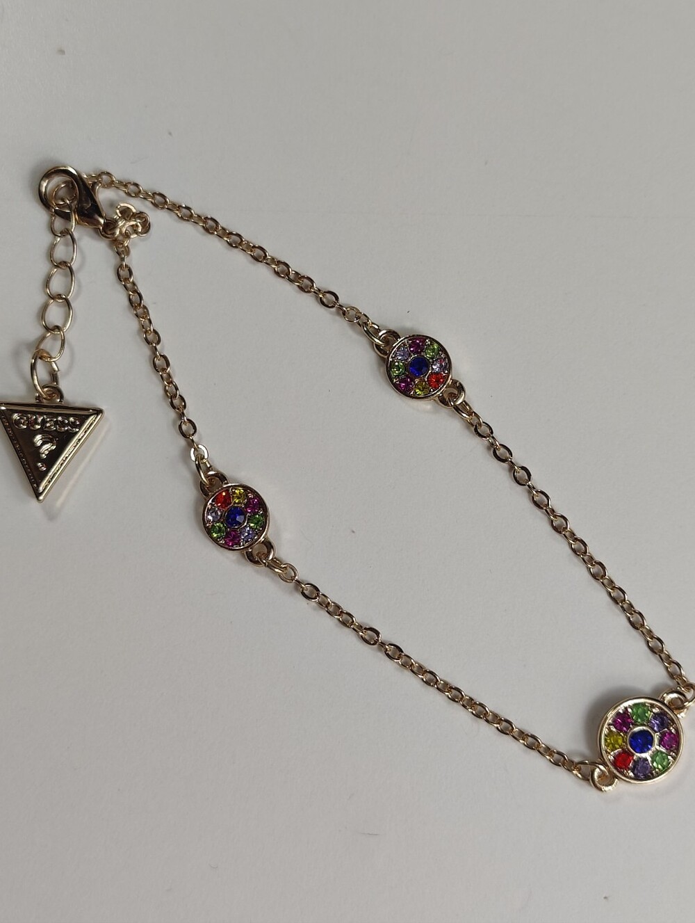 Guess Gold Tone Rainbow Crystal Bracelet Multicolor Rhinestone Charm Logo